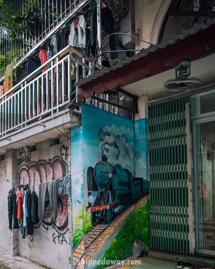 Art on walls and doors of Hanoi's Train Street