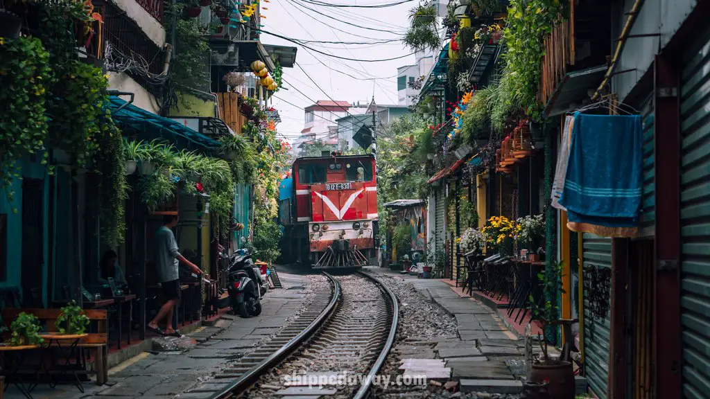 Train passing through Hanoi's Train Street