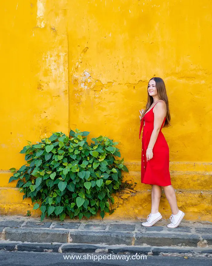 Arijana Tkalčec in front of the yellow wall in Hoi An Old Town