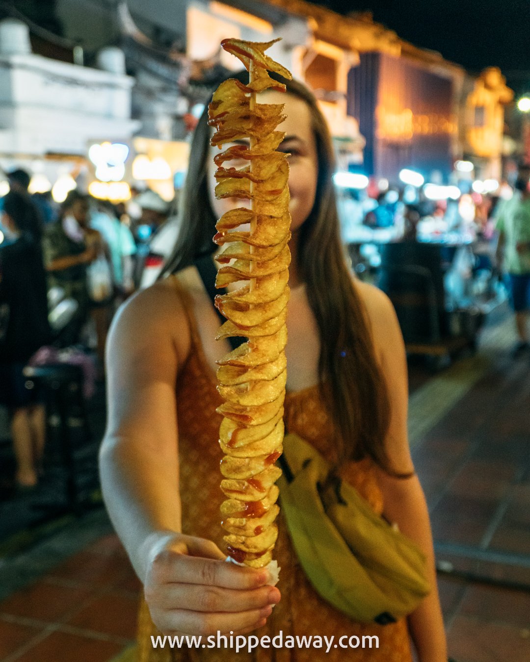 Arijana with twister tornado potato at Jonker Street Night Market, Melaka (Malacca), Malaysia