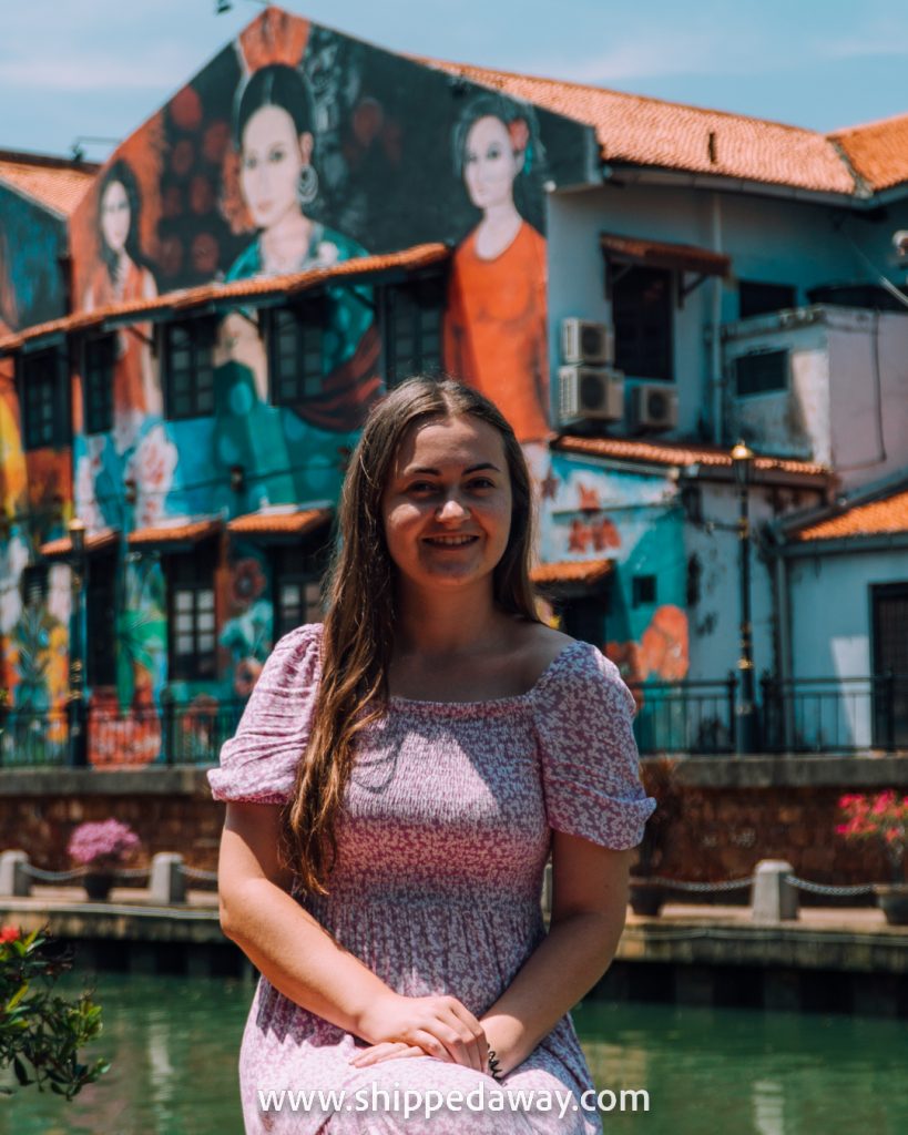 Arijana Tkalcec in front of beautiful murals on Melaka's riverside in Malaysia