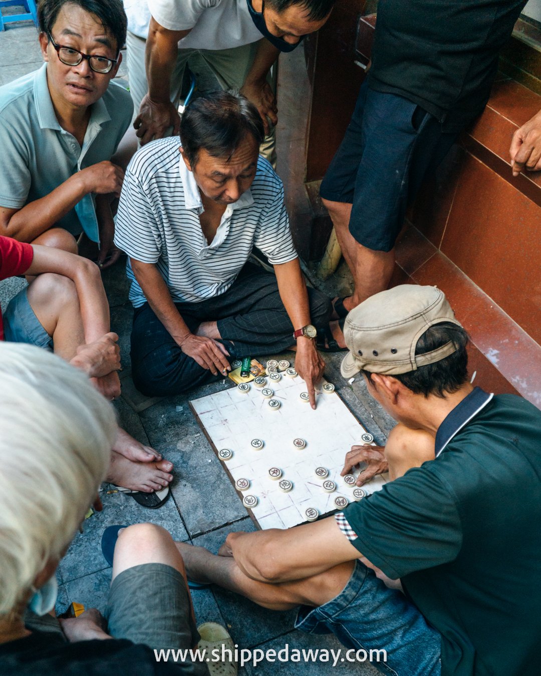 Locals playing Vietnamese chess on the street in Hanoi's Old Quarter