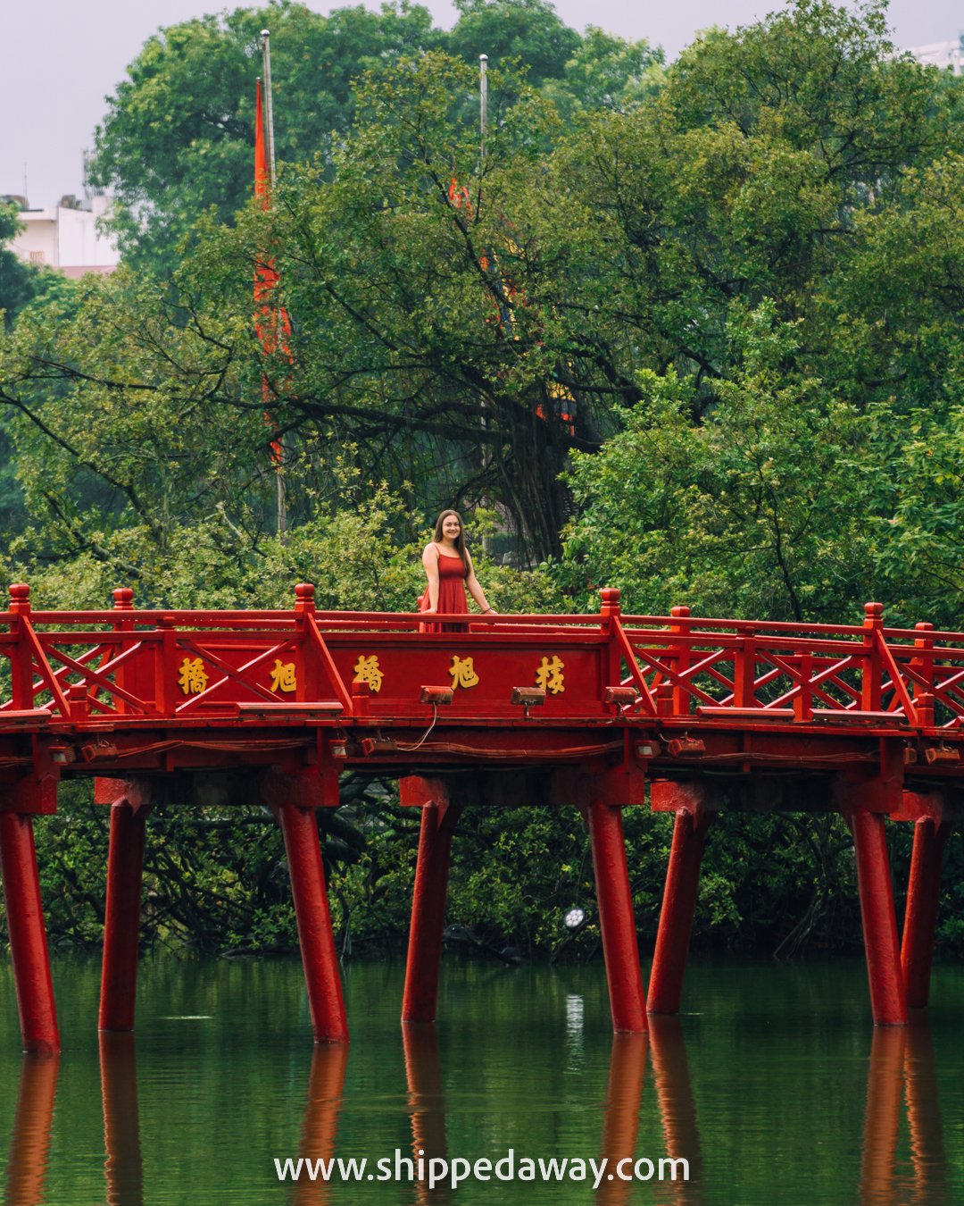 Arijana Tkalcec on the red bridge at Ngoc Son Temple, Hoan Kiem Lake, Hanoi Old Quarter