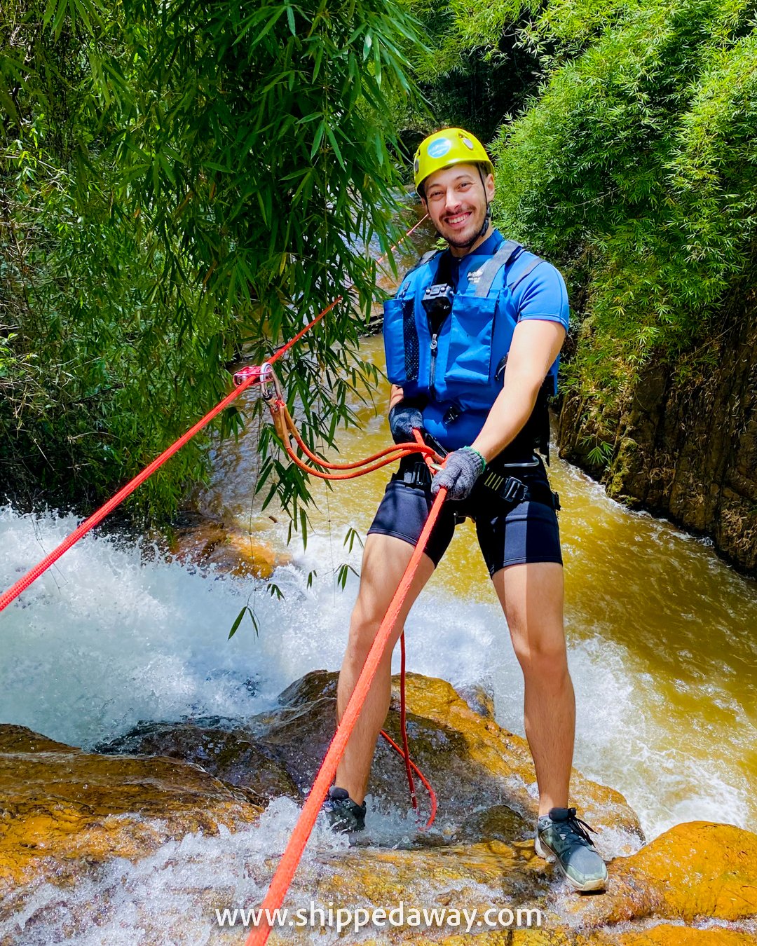 Matej Span rapelling down a waterfall while canyoning in Da Lat, Vietnam