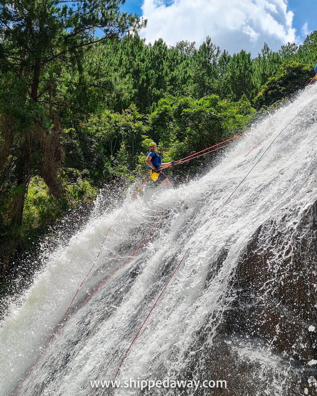Matej Span rapelling down a huge waterfall, Da Lat canyoning, Vietnam