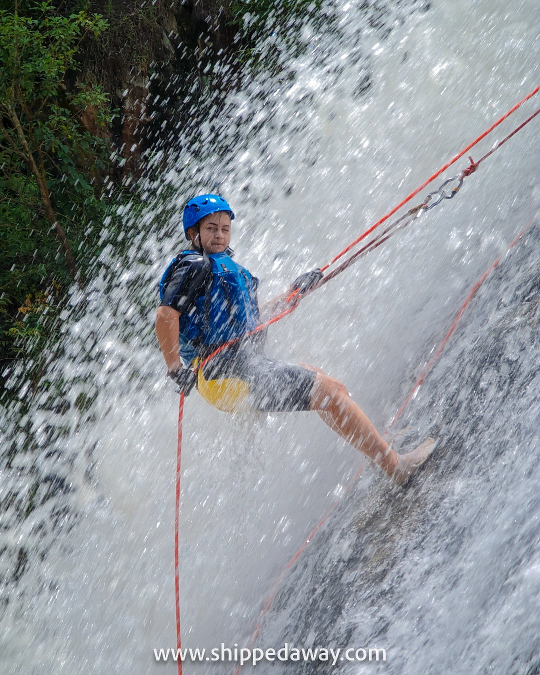 Arijana Tkalcec sliding down a huge waterfall, Da Lat canyoning, Vietnam