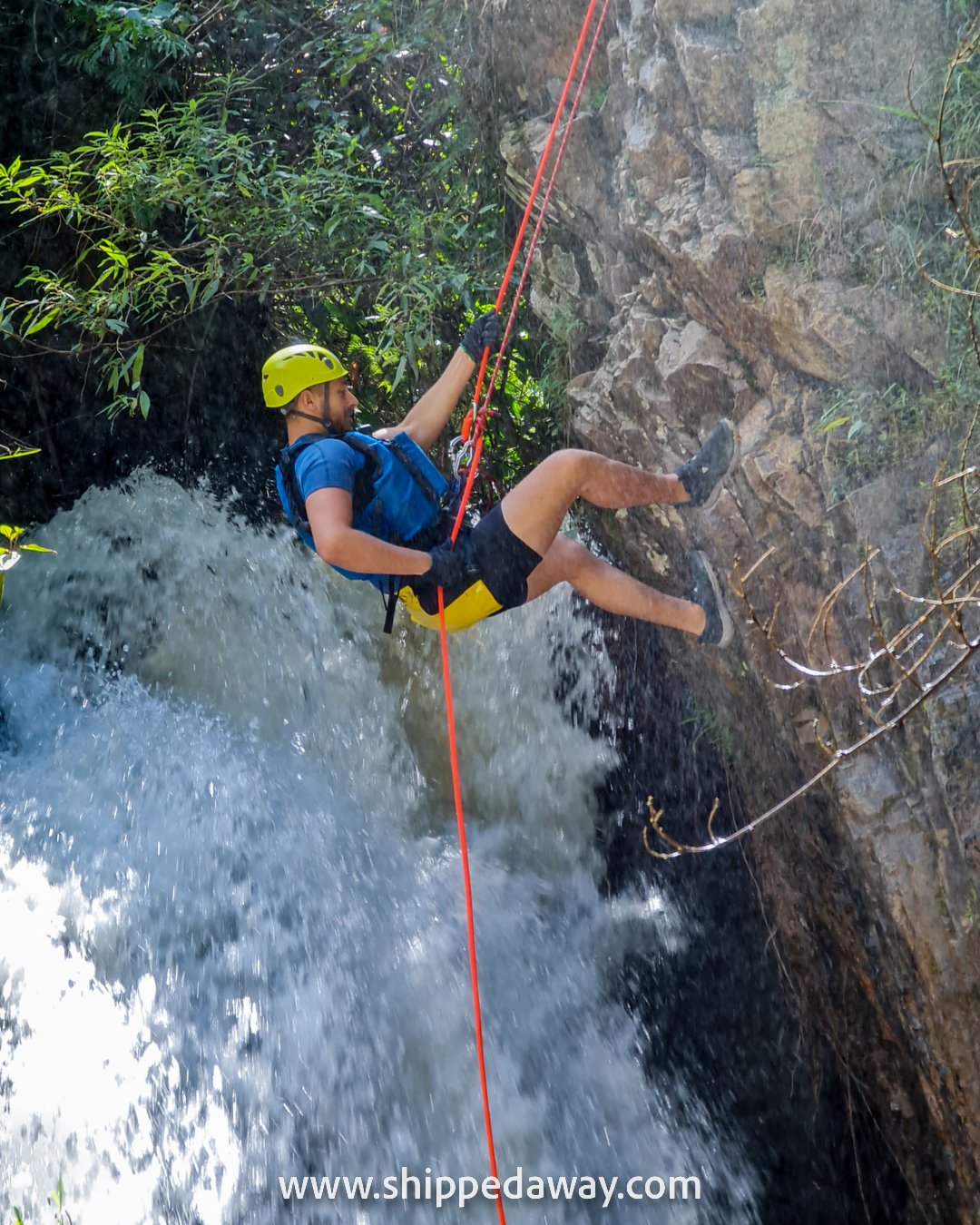 Matej Span rapelling down into the washing machine waterfall, canyoning in Da Lat, Vietnam