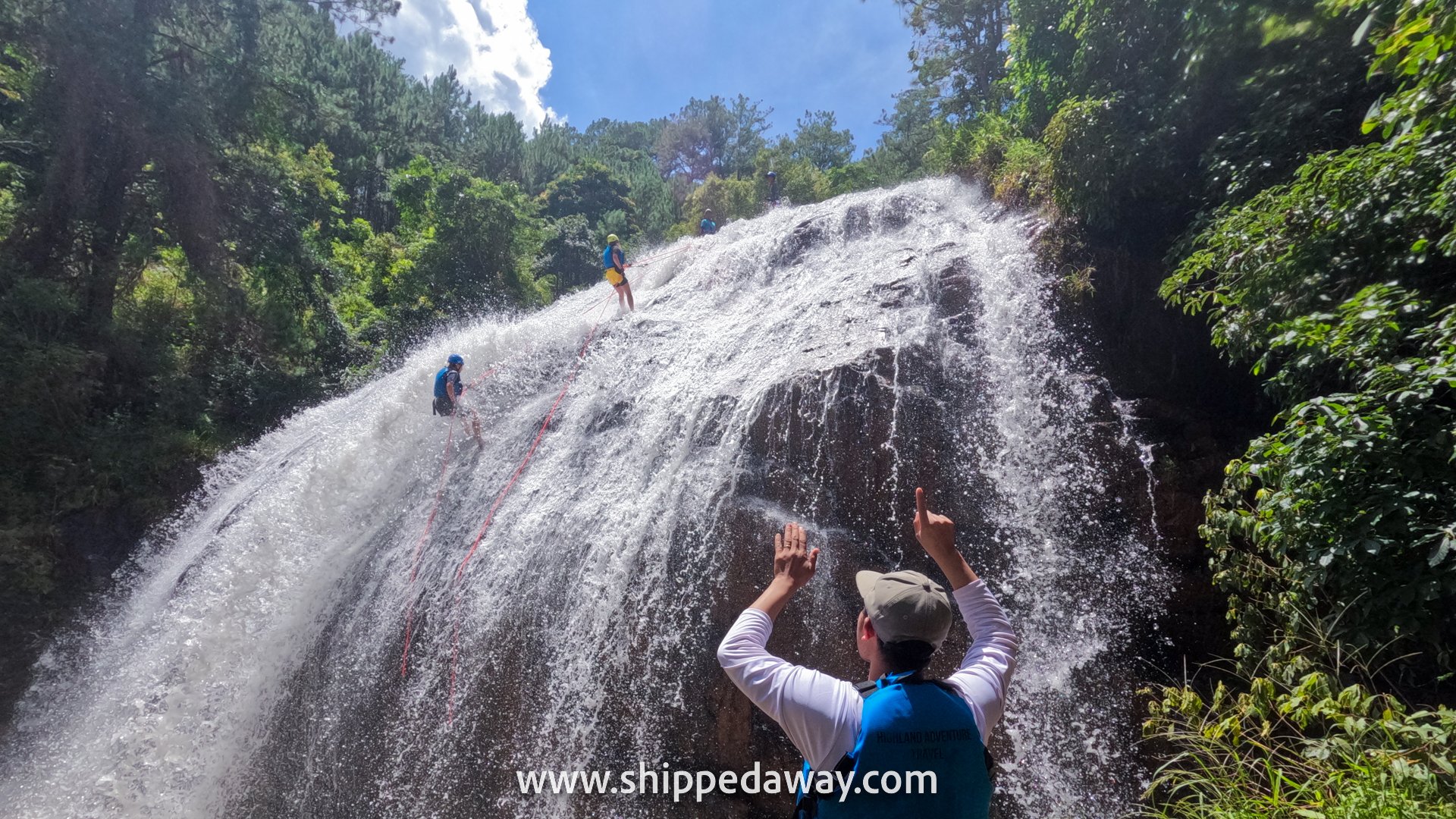 Rapelling down a huge waterfall while canyoning in Da Lat, Vietnam