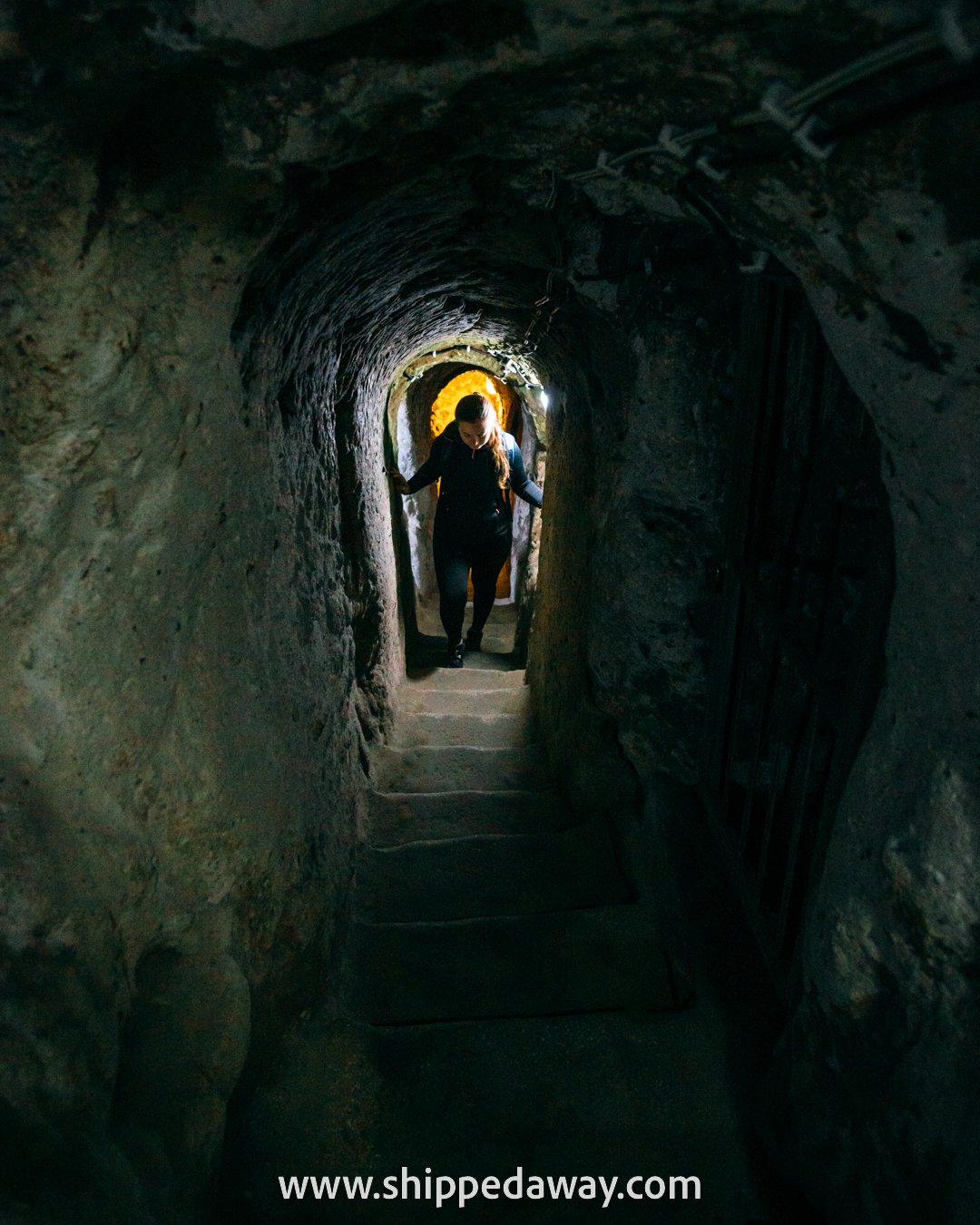 Arijana Tkalčec in steep tunnel of Derinkuyu Underground City