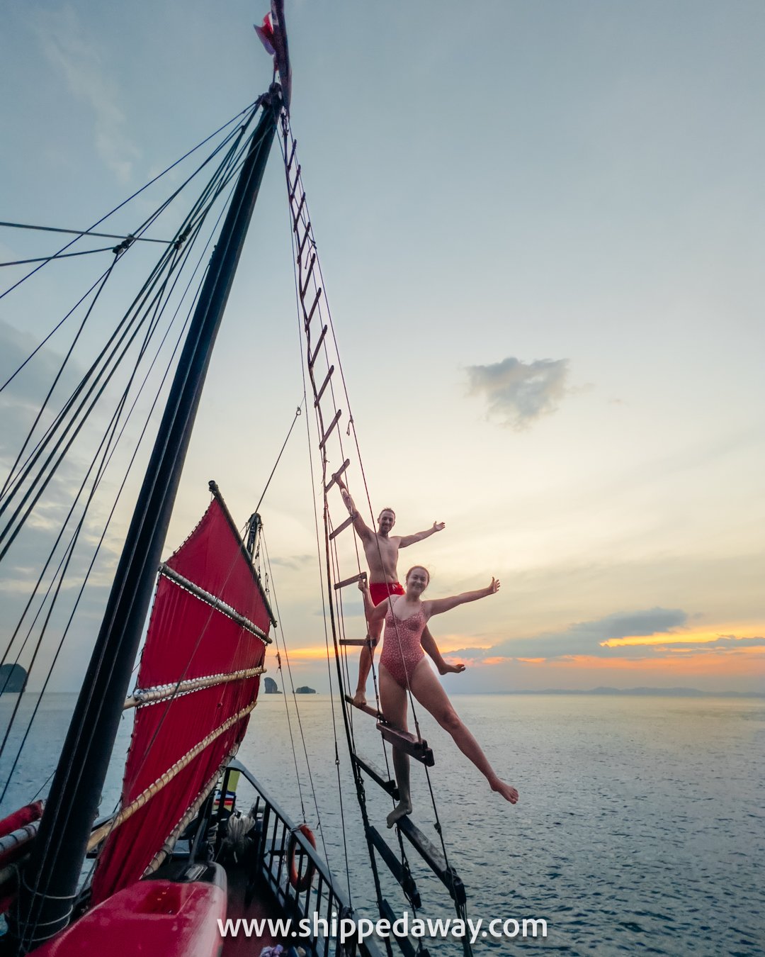 Arijana Tkalcec and Matej Span on the ladder of the ship's mast, Krabi 5 Islands Sunset Snorkeling Cruise
