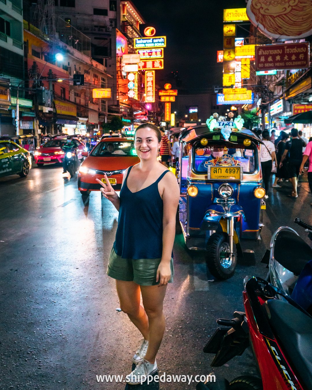 Posing for a photo in Bangkok's Chinatown at night, Thailand