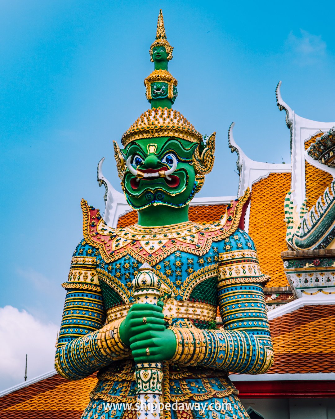 Big colorful statue at Wat Arun temple in Bangkok Thailand, best temples to visit in bangkok