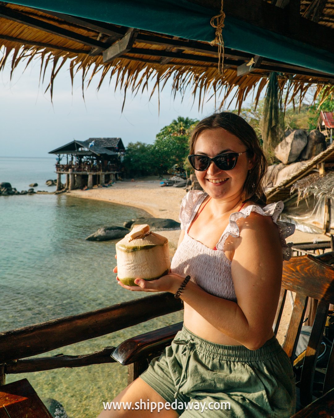 Enjoying a coconut in a bar on Sai Nuan Beach, Koh Tao, Thailand