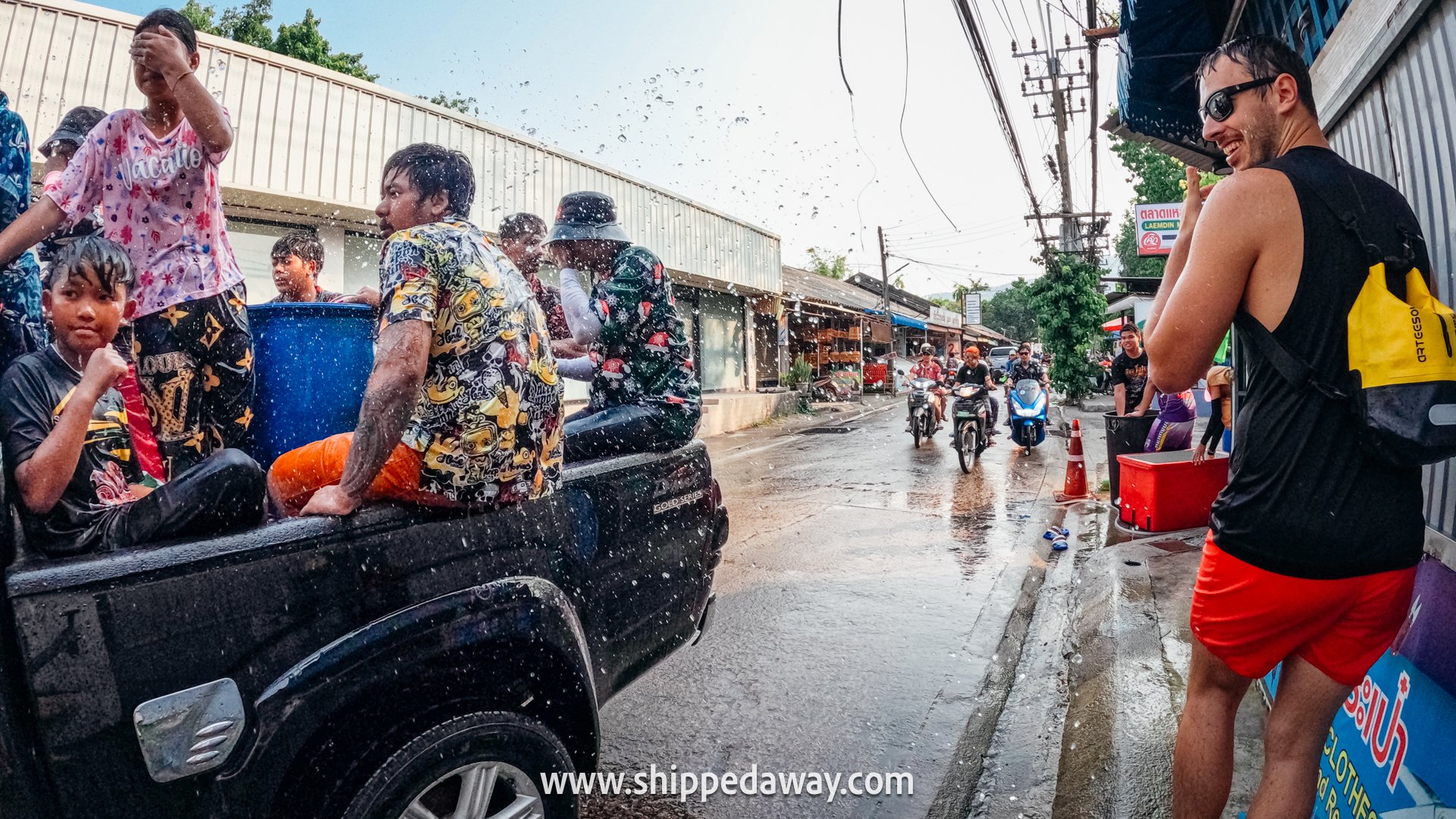 Locals and tourists splashing water during Songkran Festival - Thai New Year water festival - Songkran Festival Thailand