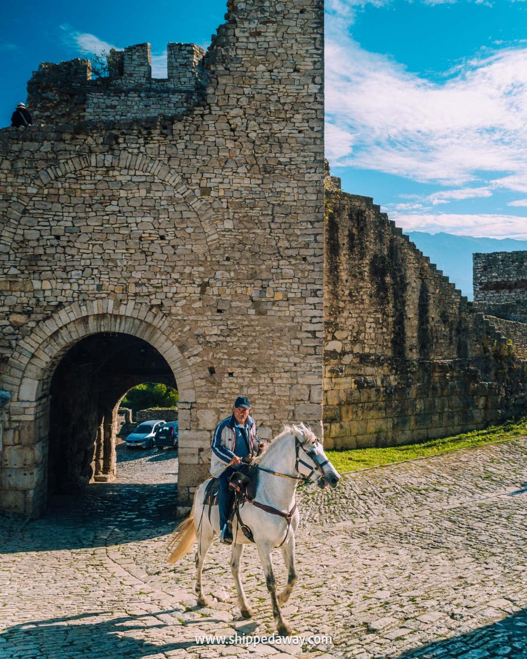 things to do in Berat - what to see and do in Berat, Albania - man riding a horse in Berat Castle