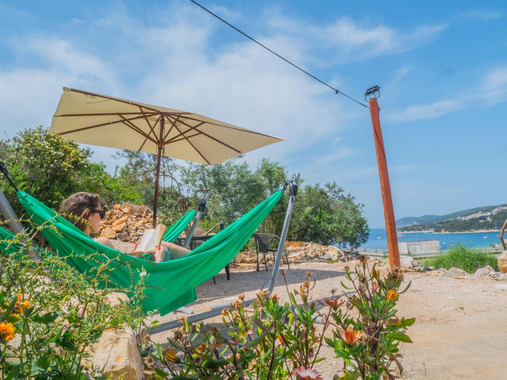 best Hvar town hotels - our favorite hotels to stay in Hvar town - Hostel Kapa outdoor chilling area