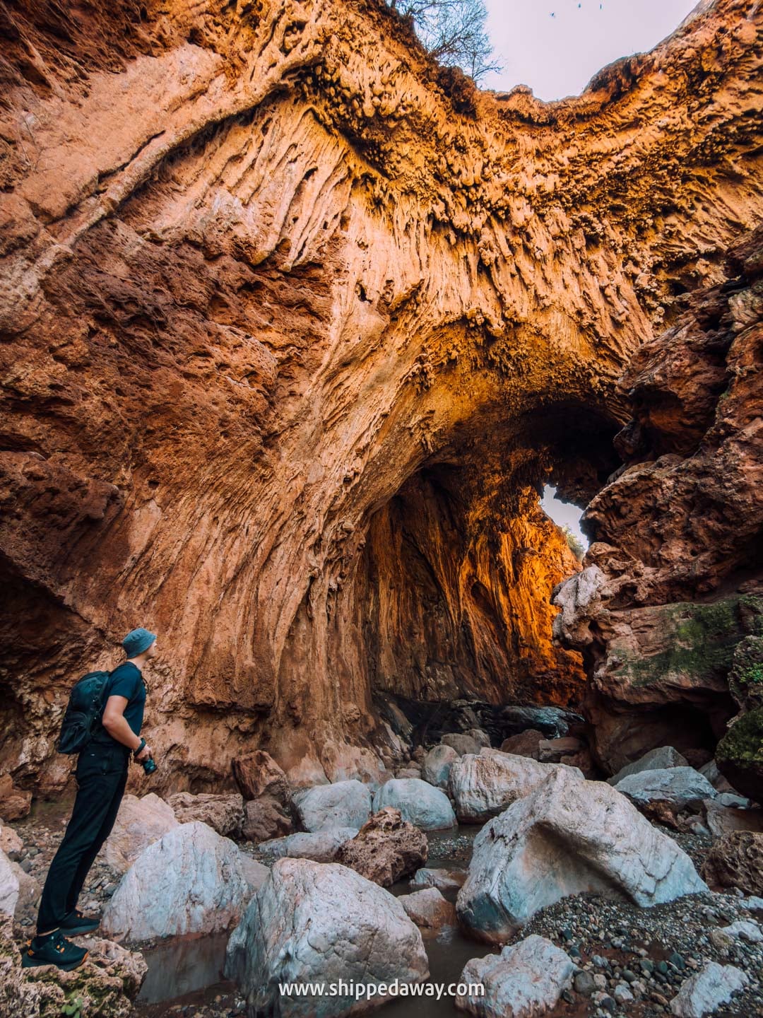Our tips for visiting Iminifri Natural Bridge in Morocco - huge size of the bridge seen below