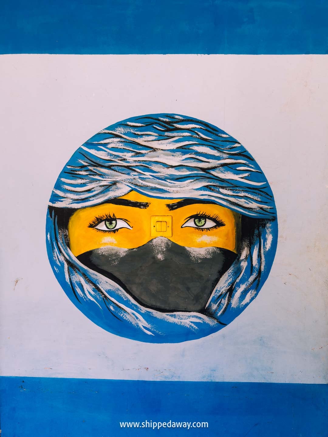 Our tips for visiting Iminifri Natural Bridge in Morocco - wall painting at the cafe