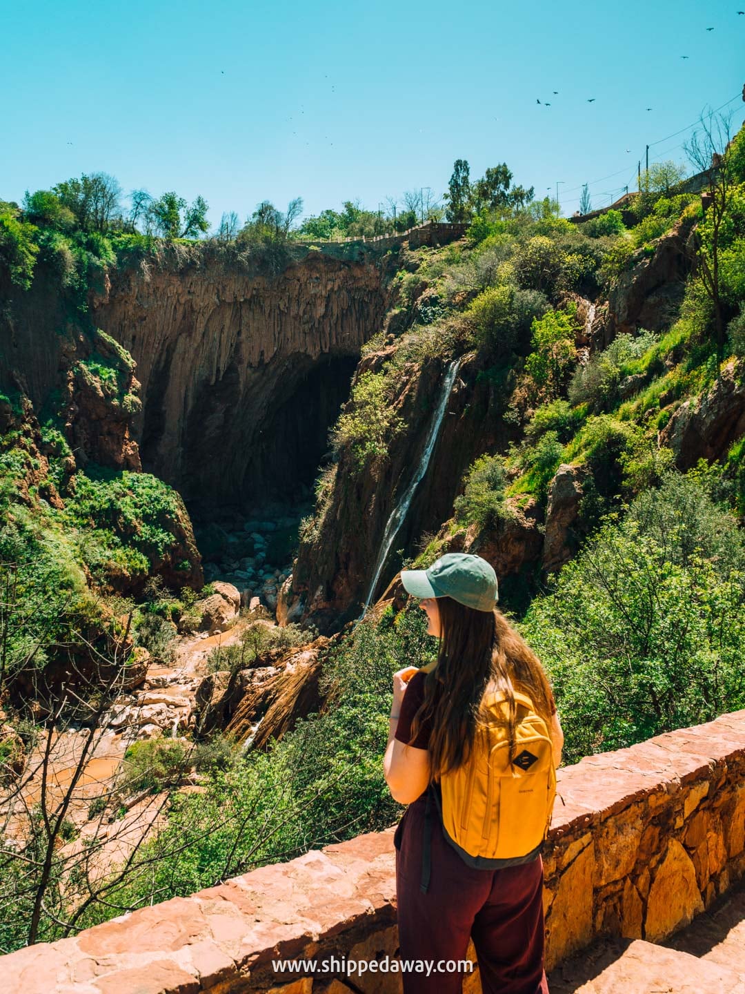 Our tips for visiting Iminifri Natural Bridge in Morocco - natural bridge and waterfall seen from the trail