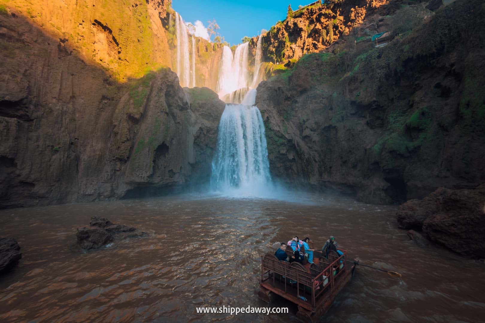 Guide to Ouzoud Waterfalls with tips from our two-night visit - boat/raft taking people closer