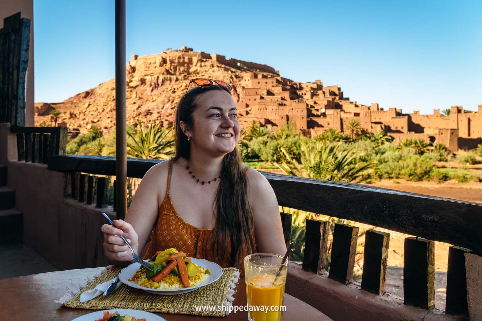 Ait Benhaddou Travel Guide - How to visit Ait Benhaddou - enjoying traditional moroccan food with a view of the town