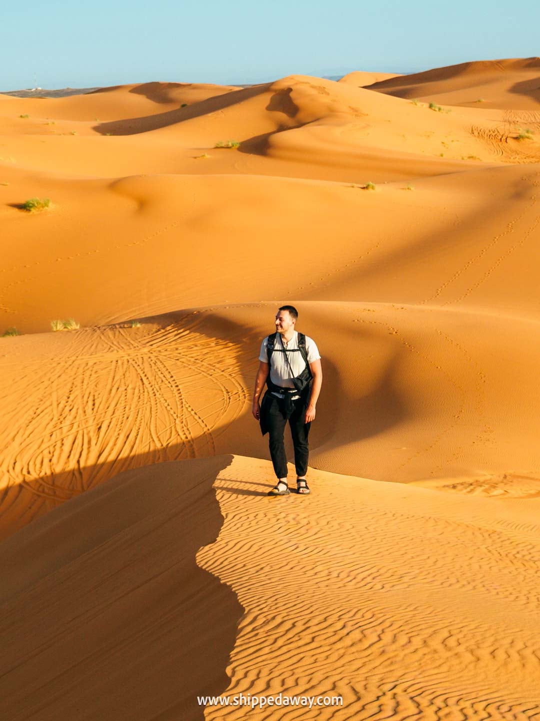 Walking up sand dunes in Merzouga, Morocco's Desert